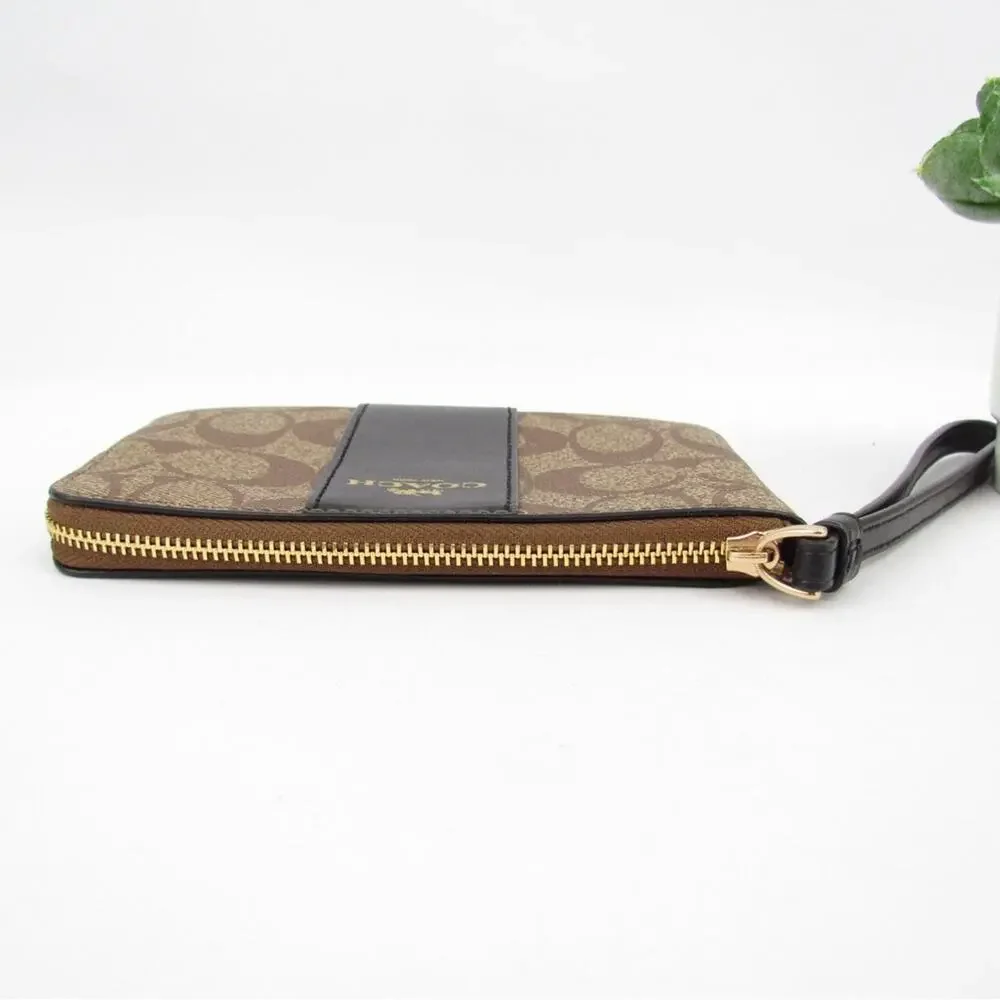 Coach Corner Zip Wristlet In Signature Canvas